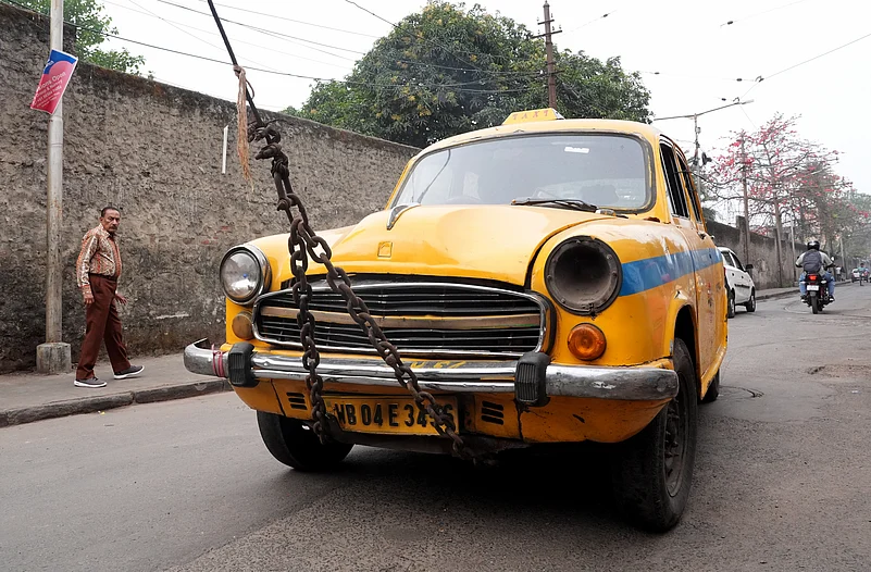 Towing the iconic yellow taxi in Kolkata due to age limit.