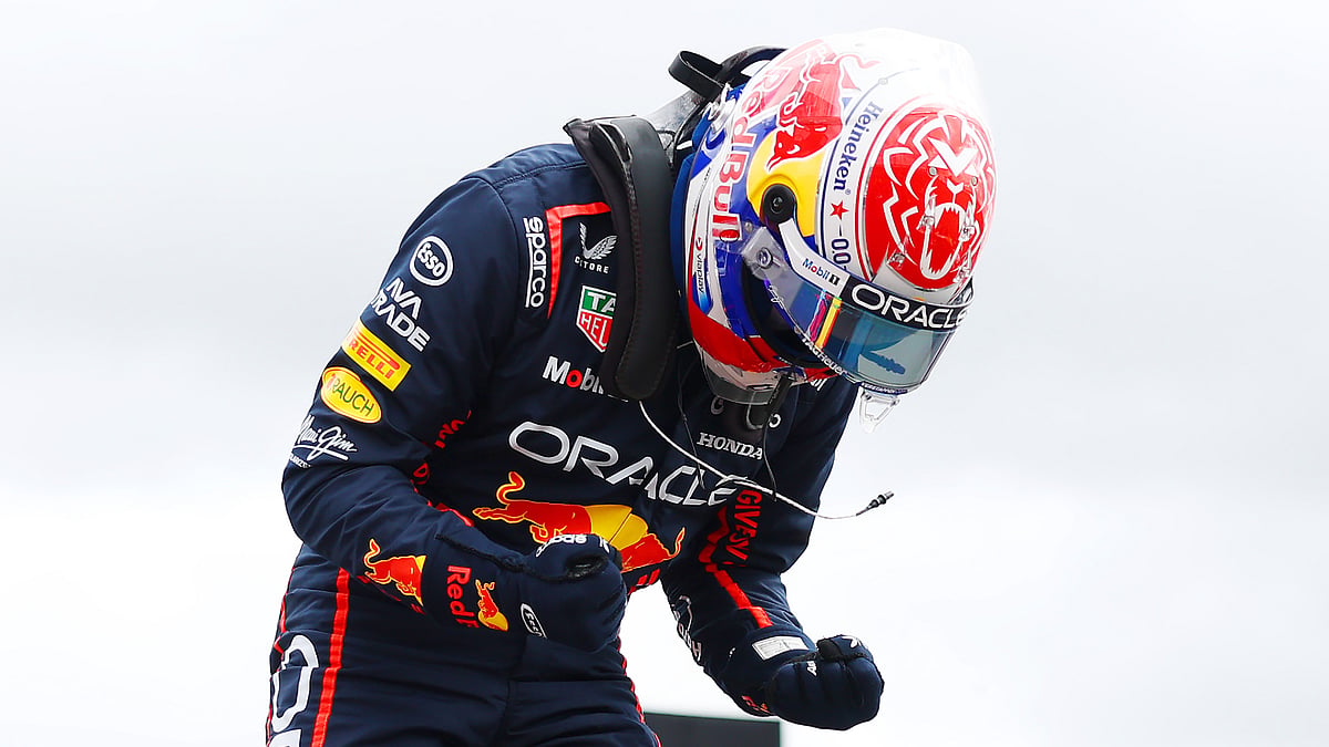 Max Verstappen celebrates after claiming pole at Silverstone