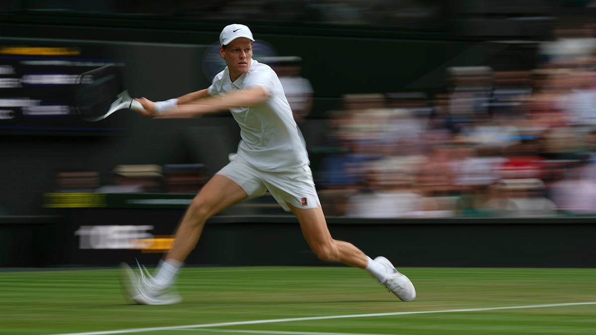 | Photo: AP/Alastair Grant : Wimbledon 2025: Jannik Sinner of Italy returns to Aleksandar Vukic of Australia during their second round men's singles match at the Wimbledon Tennis Championships in London, Thursday, July 3, 2025.