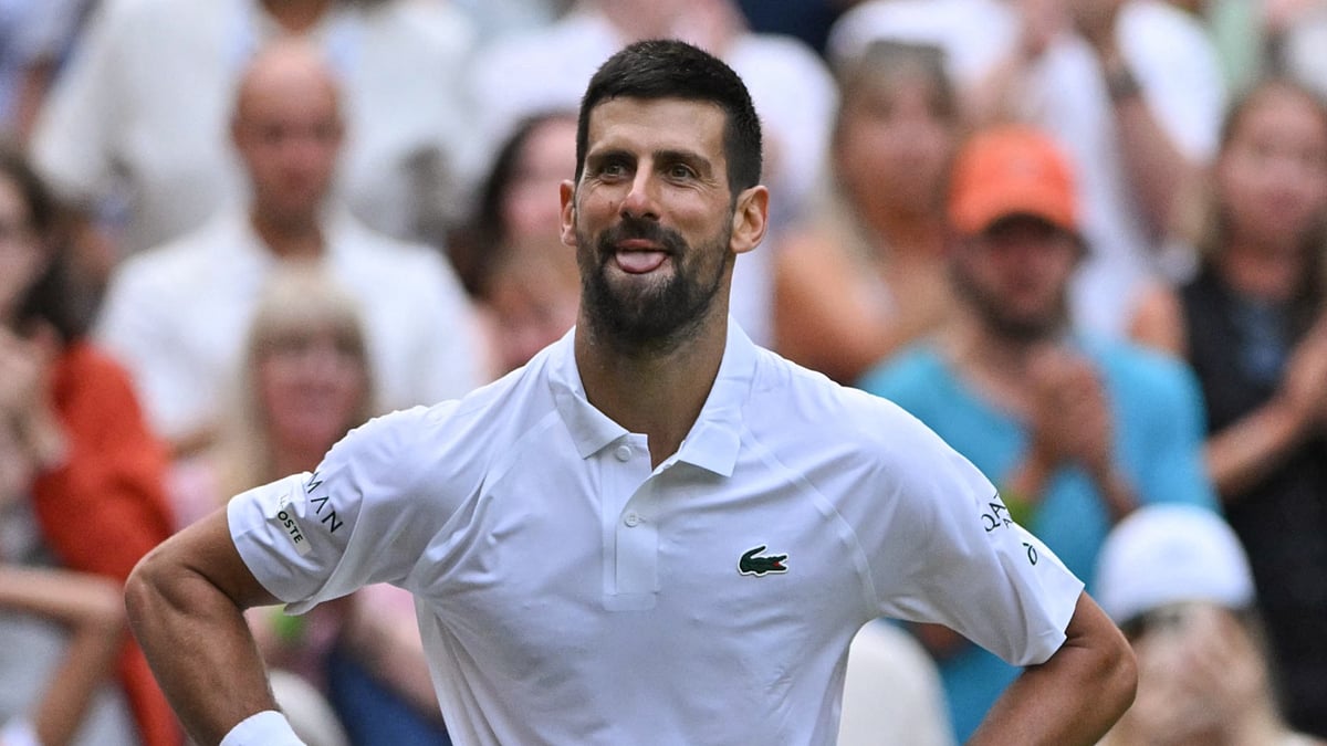 File : Novak Djokovic celebrates his 100th Wimbledon win.