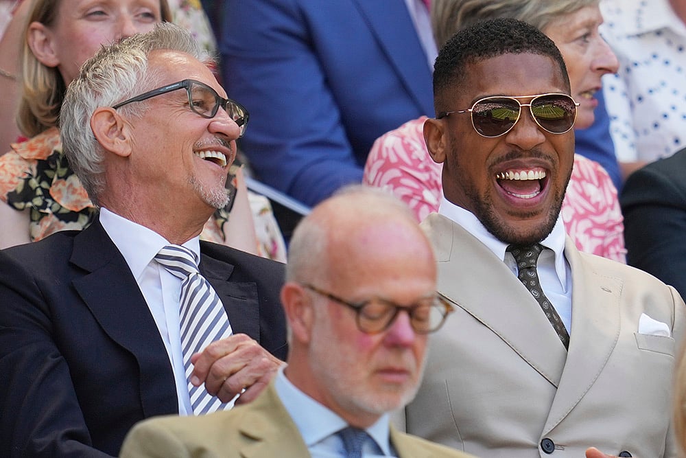 Celebrities attend 2025 Wimbledon Tennis in London_Gary Lineker, left, and boxer Anthony Joshua