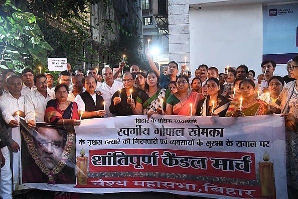 Photo by Santosh Kumar/Hindustan Times via Getty : Businessmen taking out candle march in protest against murder of famous businessman Gopal Khemka near his residence on July 7, 2025 in Patna, India.
