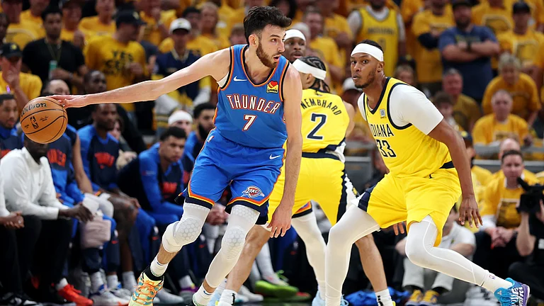 Oklahoma City Thunder center Chet Holmgren dribbles during Game 4 of the 2025 NBA Finals. - null