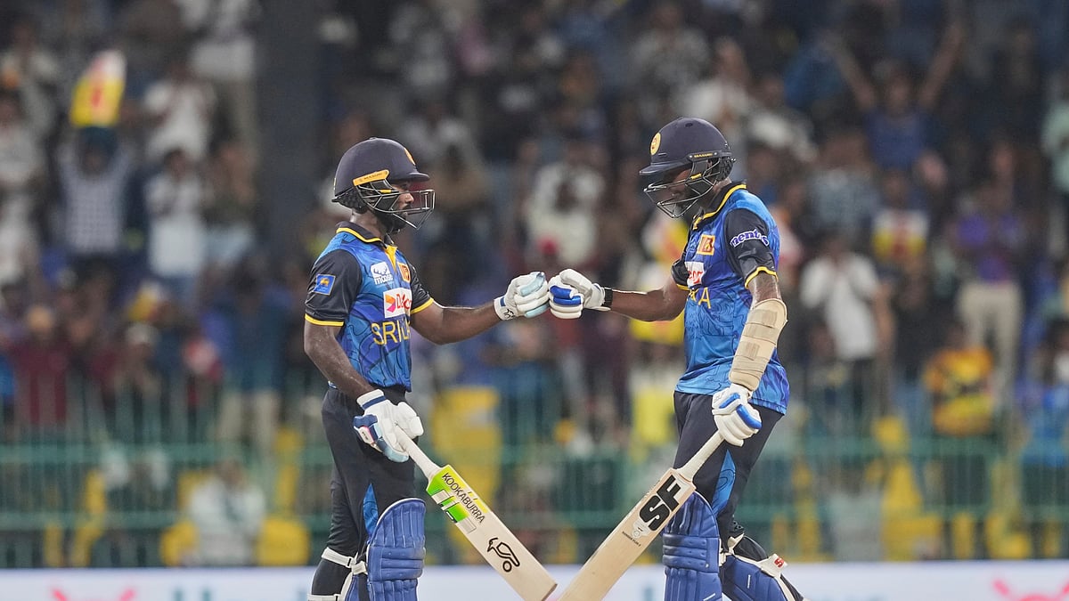 AP Photo/Eranga Jayawardena : Sri Lanka's Janith Liyanage, left, and Dushmantha Chameera bump fists after scoring runs during the first T20I cricket match between Sri Lanka and Bangladesh in Colombo, Sri Lanka.