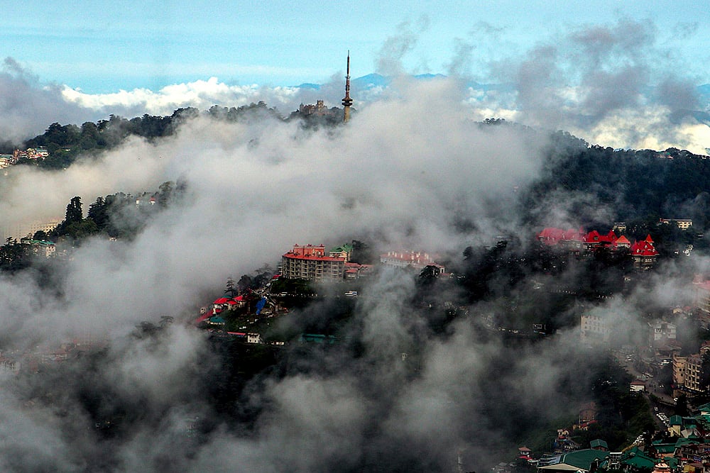 | Photo: PTI : Weather: Low clouds after rain in Shimla