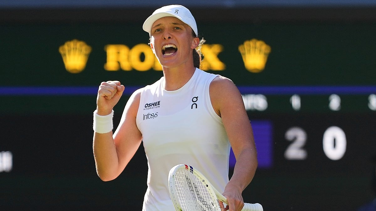 (AP Photo/Kirsty Wigglesworth) : Iga Swiatek of Poland celebrates winning the women's singles semifinal match against Belinda Bencic of Switzerland at the Wimbledon Tennis Championships in London, Thursday, July 10, 2025.
