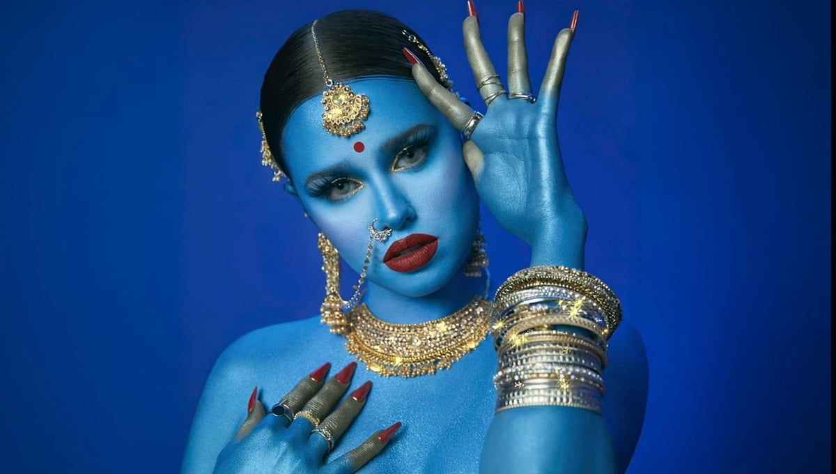 | Instagram |  : Canadian rap artist Tommy Genesis with her skin painted in vivid blue