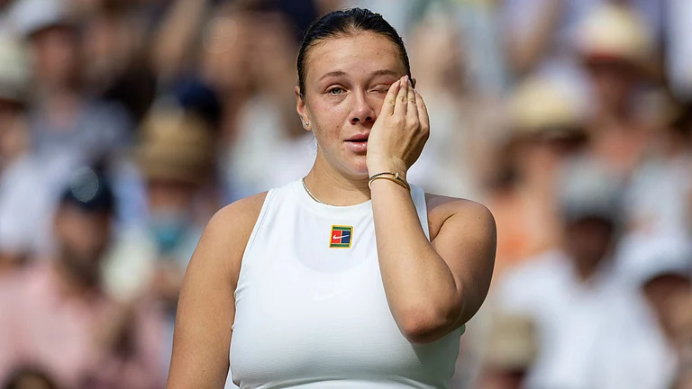 Anisimova cut an emotional figure following her Wimbledon final defeat - null