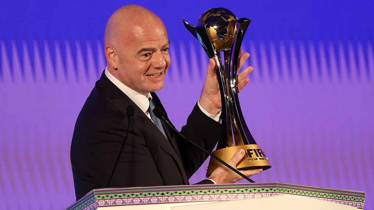 File : FIFA president Gianni Infantino with the Club World Cup trophy.