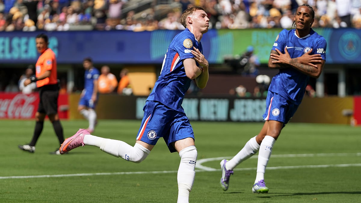 Chelsea's Cole Palmer, left, reacts after scoring a goal against Paris Saint-Germain during the first half of the Club World Cup final soccer match in East Rutherford, N.J., Sunday, July 13, 2025.