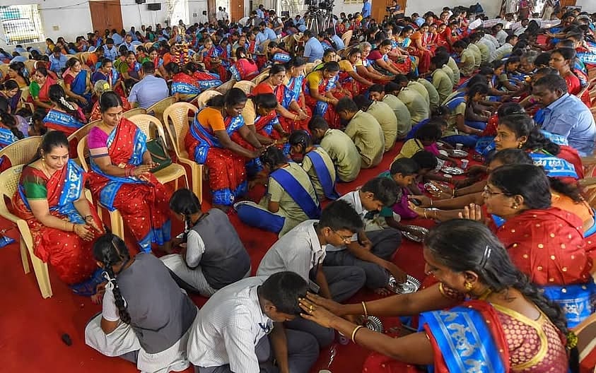 PTI : Students performing the 'Pada Pooja' in Kerala