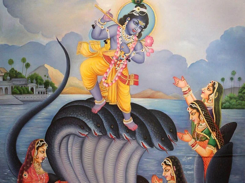 Lord Krishna standing on a snakes head, holding a flute