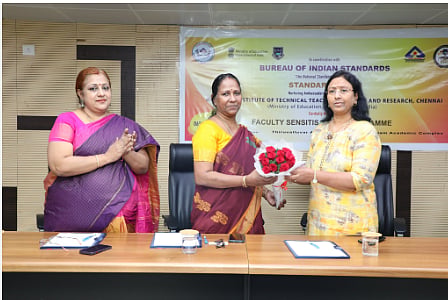 Image from X : Standing in the middle; Meenakshi Ganesan at a BIS event. 
