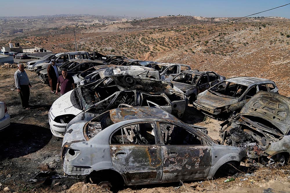 Israel-Palestine conflict in photo; vehicles were scorched during an Israeli settlers in West Bank