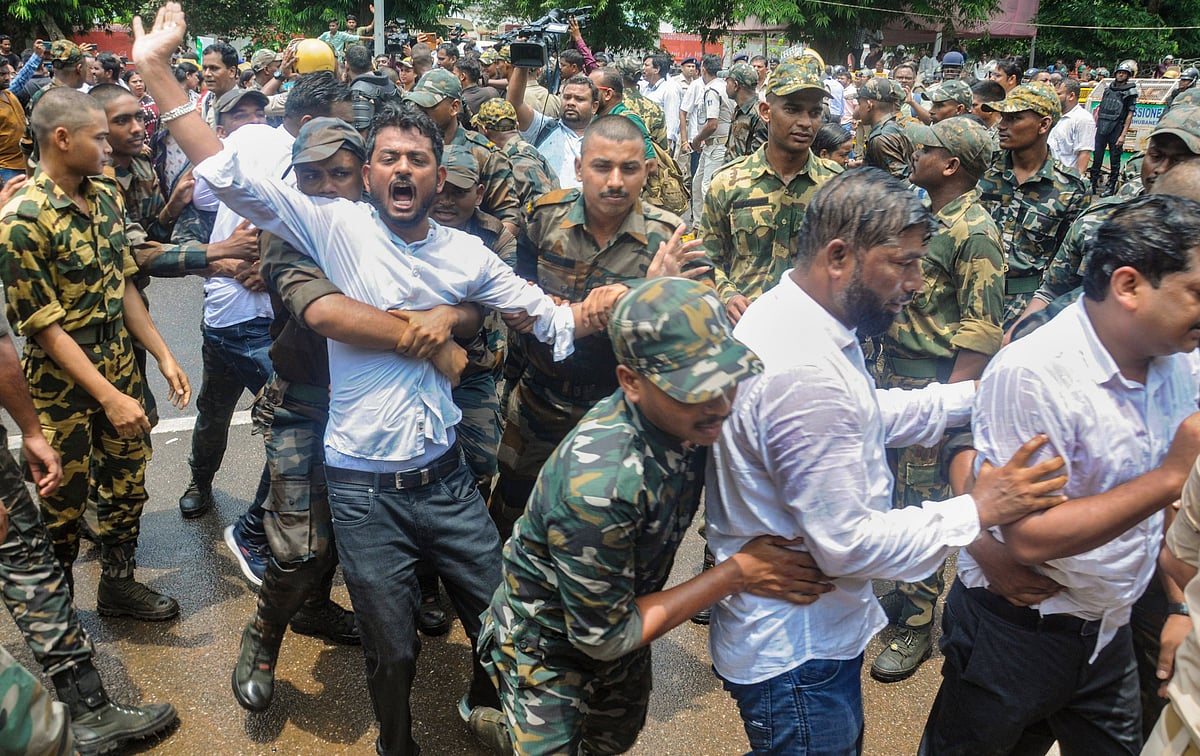 PTI : Bhubaneswar: Security personnel detain BJD workers during a protest over the death of a college student in Odisha's Balasore district, in Bhubaneswar, Wednesday, July 16, 2025. A female student set herself on fire after alleged sexual harassment by a professor at Balasore's Fakir Mohan (Autonomous) College on Saturday. 