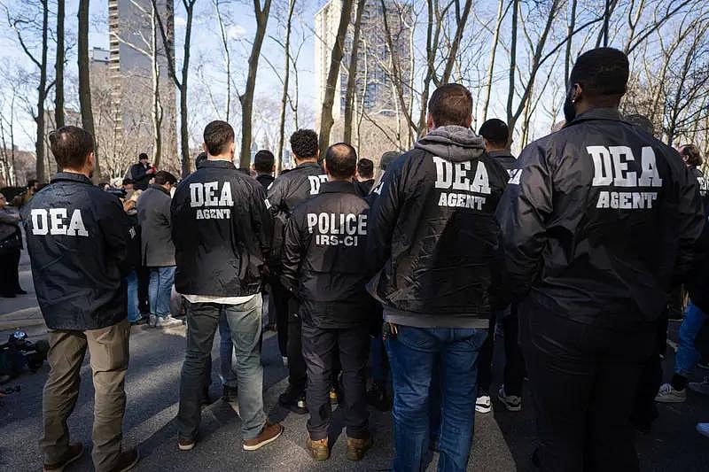 DEA agent stamding  together