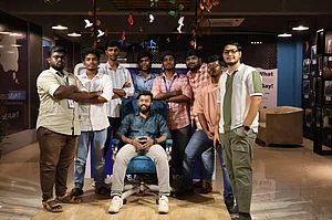 CEO Vikash Manoharan in centre with the core team at TourOn