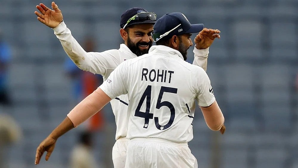 | Photo: AP : File photo of Virat Kohli and Rohit Sharma in action for India in Test cricket.