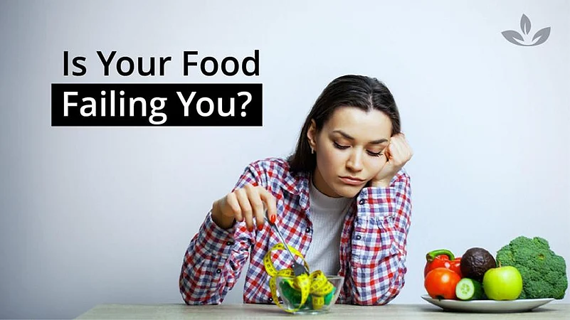 Tired woman with salad, showing lack of nutrition
