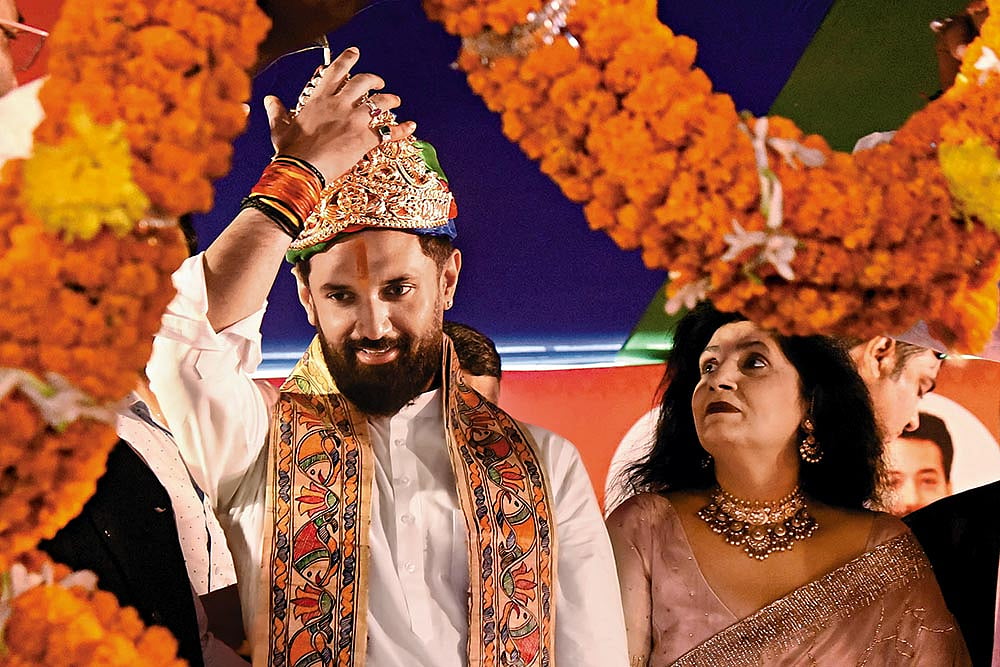 | Photo: Getty Images : Political Game: Chirag Paswan being honoured during the foundation day of his party in Patna  
