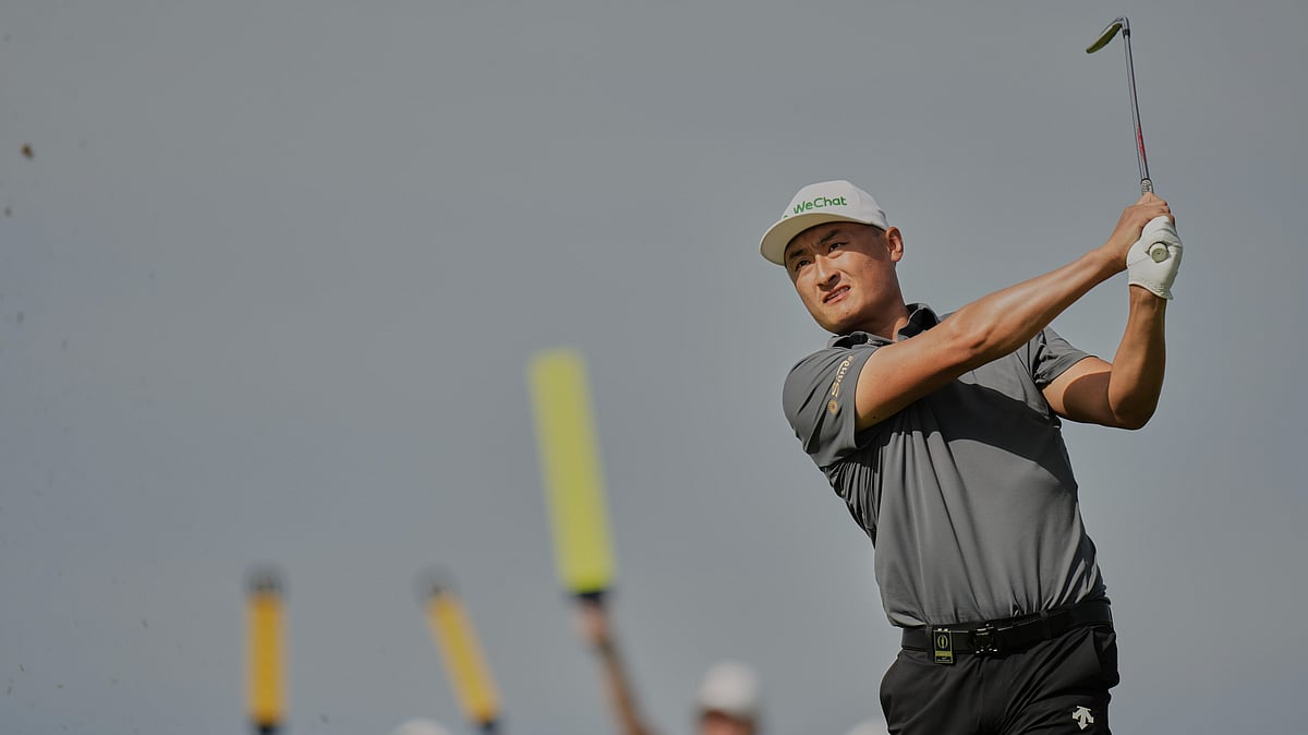 Li Haotong of China plays his shot on the 6th tee during the third round of the British Open golf championship at the Royal Portrush Golf Club, Northern Ireland. - AP Photo/Francisco Seco