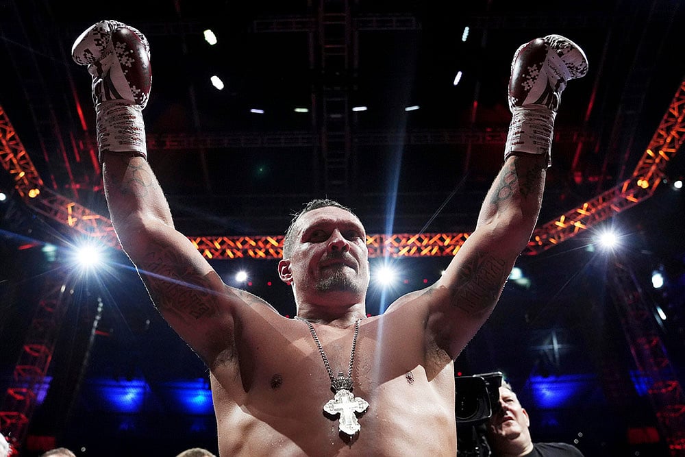 | Photo: Bradley Collyer/PA via AP : World heavyweight boxing title fight: Oleksandr Usyk vs Daniel Dubois