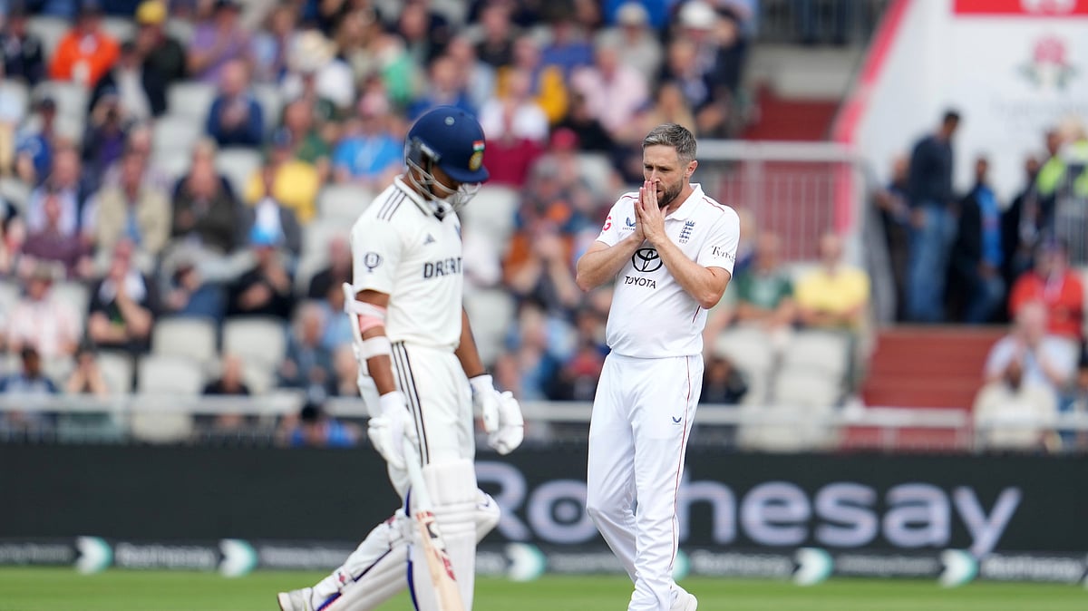 Englands Chris Woakes reacts after bowls a delivery on the first day. AP