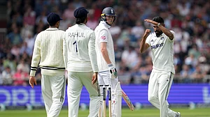 AP Photo/Jon Super : India's Mohammed Siraj, right, call for third umpire's review for the wicket of England's Zak Crawley, center, during the second day of the fourth cricket test match between England and India at Emirates Old Trafford.