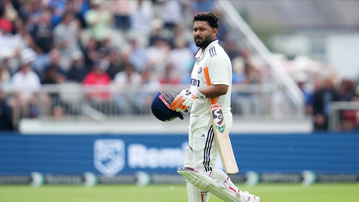 AP Photo/Jon Super : India's Rishabh Pant walks off the field after losing his wicket during the second day of the fourth cricket test match between England and India at Emirates Old Trafford, Manchester.