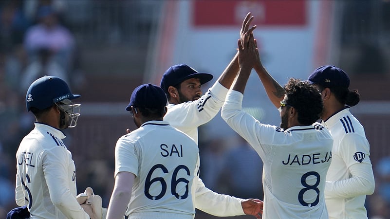 Indias Ravindra Jadeja, second right, celebrates with teammates. AP