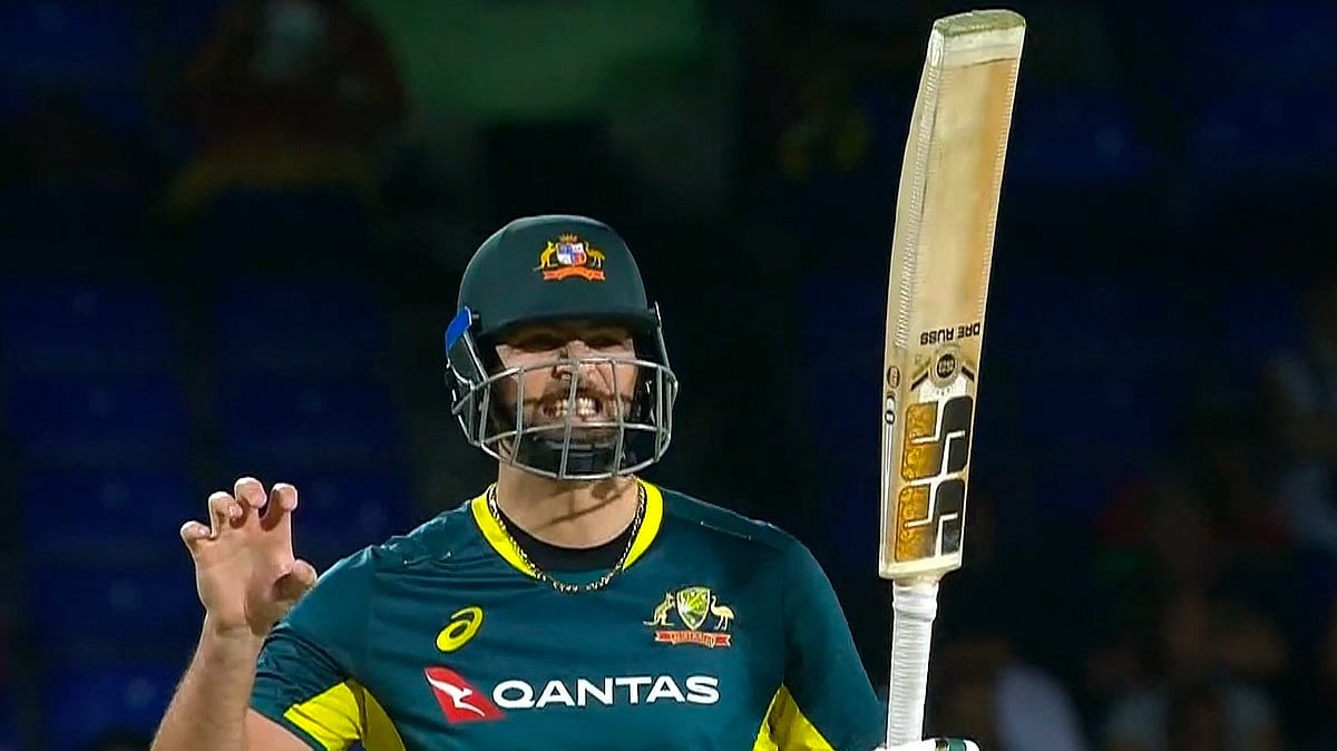 X : Tim David reacts after reaching his maiden T20I century.