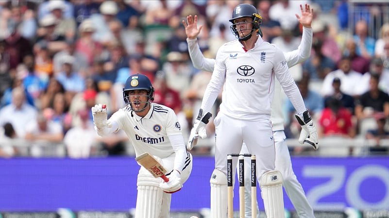 Indias captain Shubman Gill stops batting partner KL Rahul on the fourth day. AP