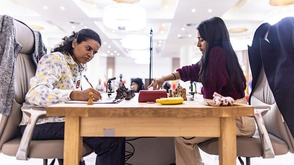 | Photo: X/FIDE_chess : Koneru Humpy in action against Divya Deshmukh in the FIDE Women's Chess World Cup 2025 final game 2.
