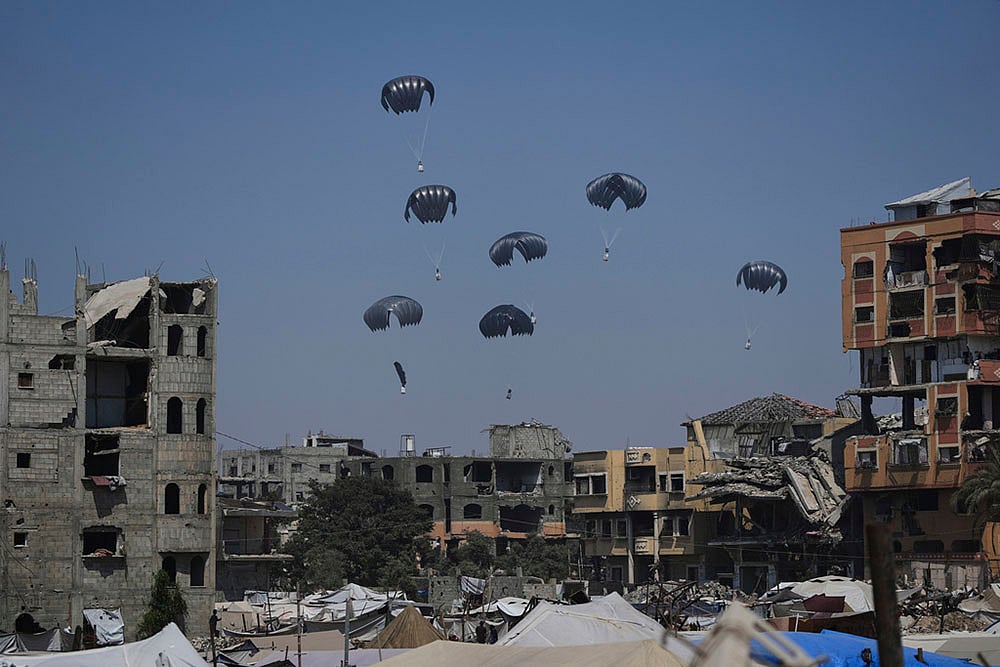 Israel Palestinians: Humanitarian Aid Is Airdropped Into Gaza_2