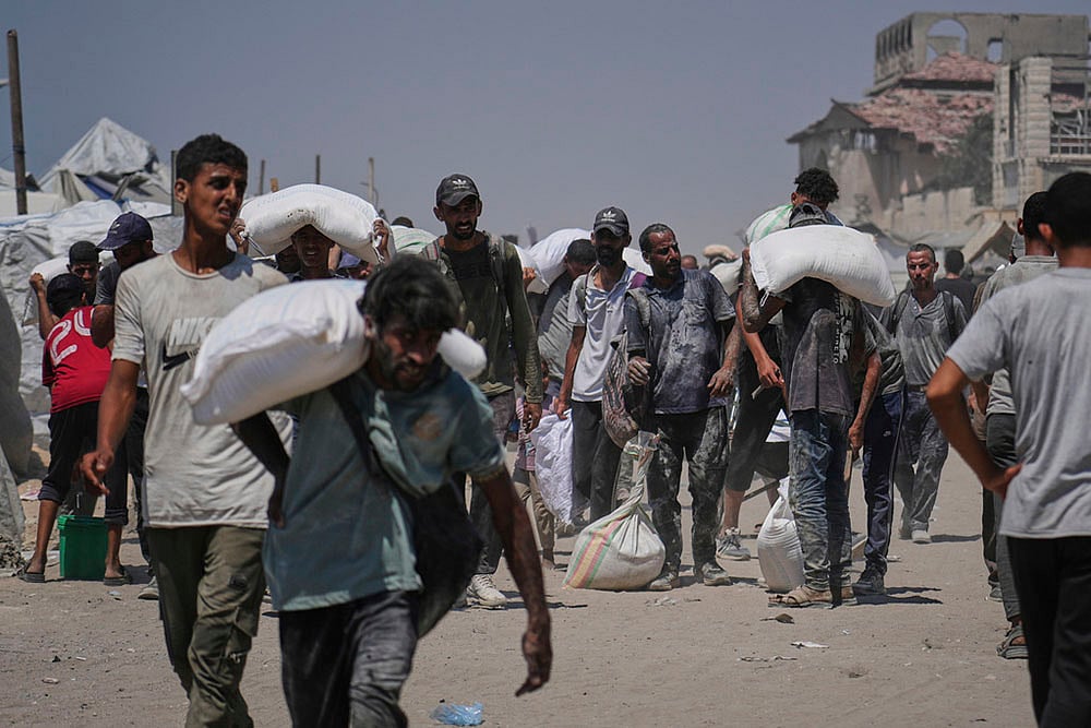 Israel Palestinians: Humanitarian Aid Is Airdropped Into Gaza_8
