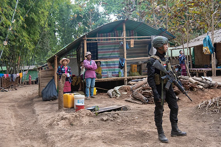KAYAH KARENNI STATE, MYANMAR. February 24, 2025: A soldier from an armed group fighting the Burmese army who took power in a coup in February 2021, stands in a camp for internally displaced people.
- Photo by Thierry Falise/LightRocket via Getty Images