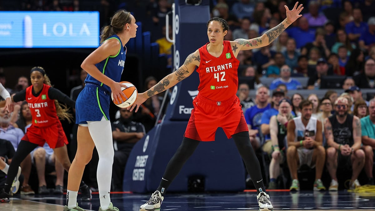 Brittney Griner #42 of the Atlanta Dream defends against Alanna Smith #8 of the Minnesota Lynx at Target Center on July 27, 2025 in Minneapolis, Minnesota.