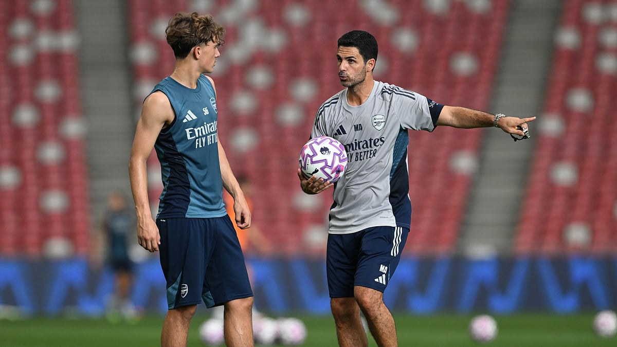 Arsenal youngster Max Dowman with manager Mikel Arteta