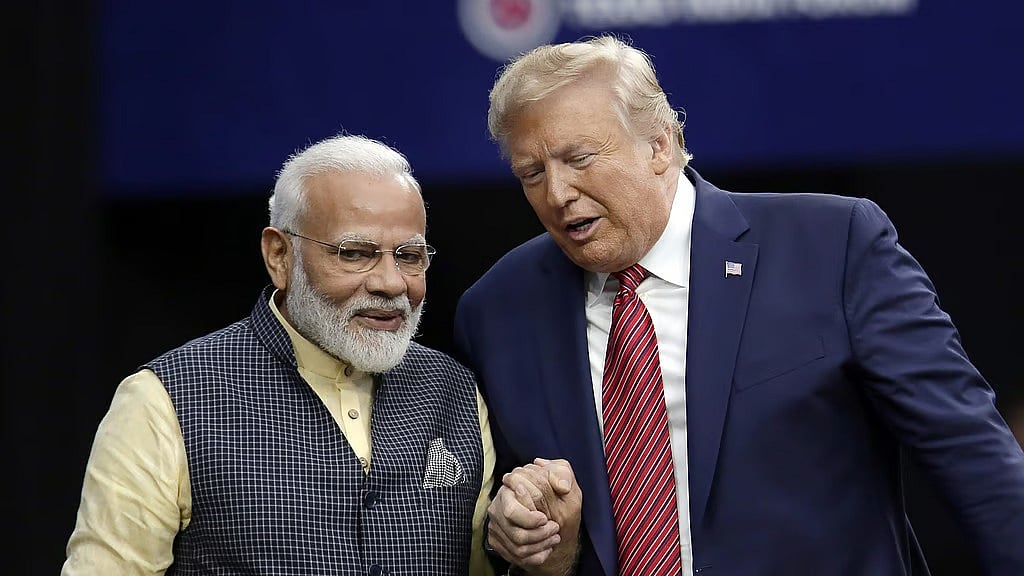 US President Donald Trump (R) with PM Modi (R)