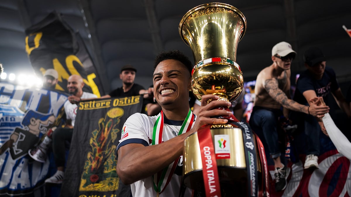 File : File photo of Bologna's Dan Ndoye with the Coppa Italia trophy.
