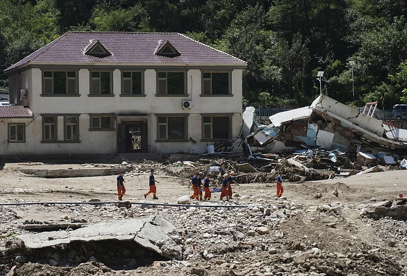 rescuers evacuate a stranded villager in Liulimiao Town
