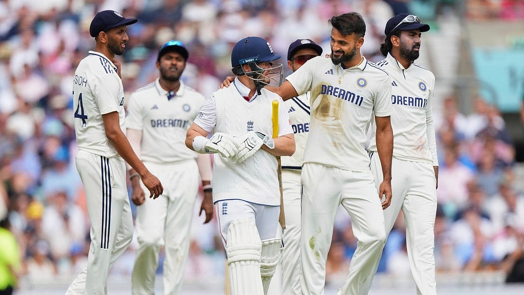 AP/Kirsty Wigglesworth : India's Akash Deep hugs England's Ben Duckett after taking his wicket during the second day of the fifth cricket test