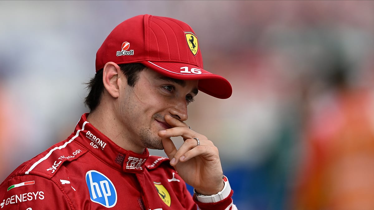AP Photo/Denes Erdos : Ferrari driver Charles Leclerc of Monaco celebrates his pole position after the qualifying session for the Hungarian Formula One Grand Prix at the Hungaroring racetrack in Mogyorod, Hungary.