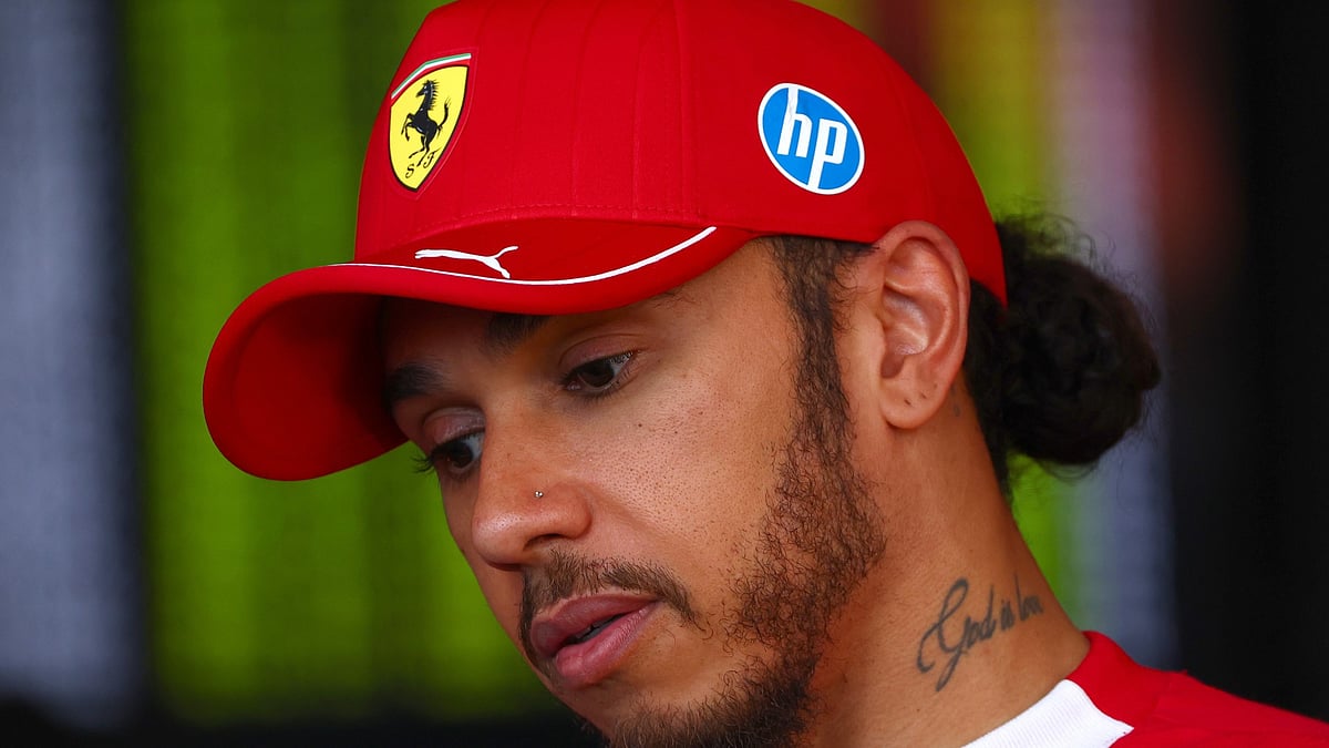 A deflated Lewis Hamilton looks on after the Hungarian Grand Prix.