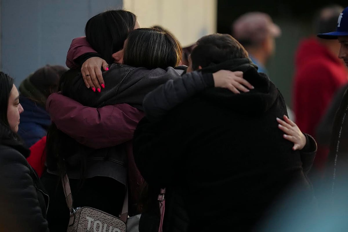 AP  : Relatives of a missing miner embrace in front of the offices of Codelco 