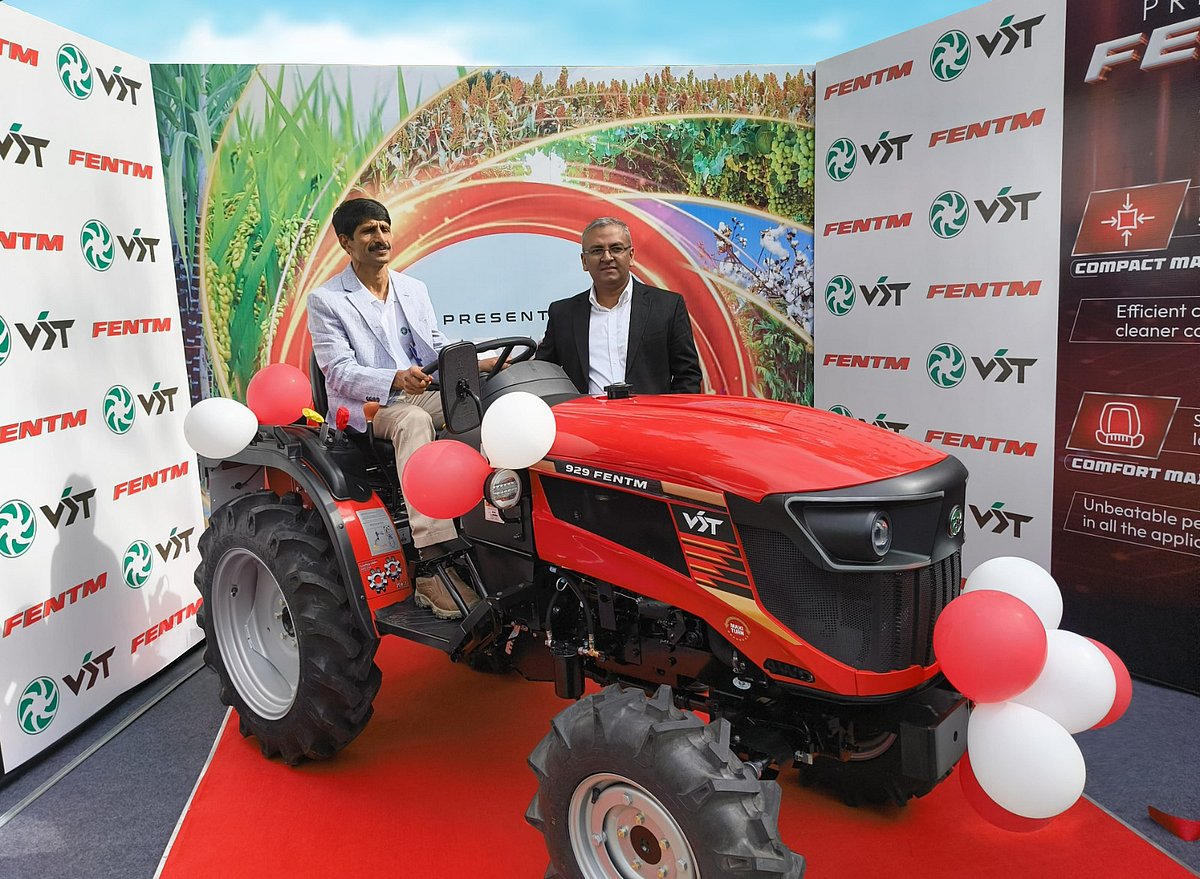 Launch event of the VST 929 FENTM tractor, showcasing its sleek design and advanced features, with executives posing proudly beside it.