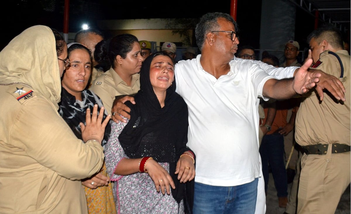 PTI : Bereaved family members of Parvaiz mourn outside the mortuary of a hospital, in Jammu.