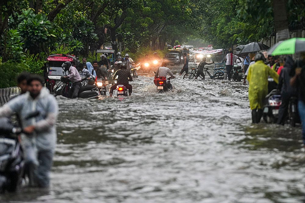 | Photo: PTI/Salman Ali : Weather: Rain in Delhi