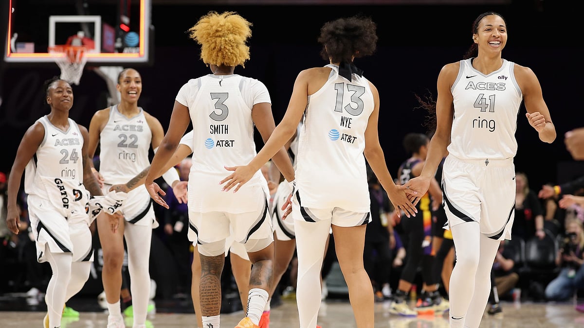 Kiah Stokes #41 of the Las Vegas Aces celebrates with teammates after defeating the Phoenix Mercury in the WNBA game at PHX Arena on August 15, 2025 in Phoenix, Arizona. The Aces defeated the Mercury 86-83.