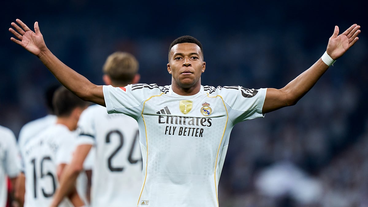 Kylian Mbappe celebrates after beating Sergio Herrera from the spot